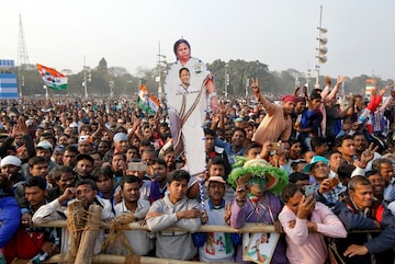 A supporter holds a cut-out of Mamata Banerjee, Chief Minister of the state of West Bengal,