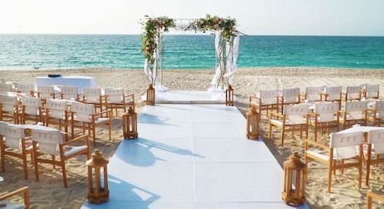 Nikki Beach Dubai | Nestled amidst Dubai's vibrant energy, Nikki Beach Resort & Spa embodies romance, offering a picturesque canvas for your dream wedding. Whether it's an intimate affair or a grand celebration, Nikki Beach caters to every desire with its stunning venues. Picture exchanging vows on the white sandy beach, with the Arabian Gulf as your backdrop, or opt for the timeless elegance of the Celebrations’ Ballroom. For those seeking laid-back vibes, the Key West venue provides a cozy yet spacious setting, while the Ultimate Beach villa offers an intimate gathering with a private pool. And for a truly grand occasion, there's nothing quite like the iconic Nikki Beach Dubai, where guests can arrive in style at the Beach Club jetty, setting the stage for an unforgettable celebration of love. (Image: Tourism Dubai) Nikki Beach Dubai | Nestled amidst Dubai's vibrant energy, Nikki Beach Resort & Spa embodies romance, offering a picturesque canvas for your dream wedding. Whether it's an intimate affair or a grand celebration, Nikki Beach caters to every desire with its stunning venues. Picture exchanging vows on the white sandy beach, with the Arabian Gulf as your backdrop, or opt for the timeless elegance of the Celebrations’ Ballroom. For those seeking laid-back vibes, the Key West venue provides a cozy yet spacious setting, while the Ultimate Beach villa offers an intimate gathering with a private pool. And for a truly grand occasion, there's nothing quite like the iconic Nikki Beach Dubai, where guests can arrive in style at the Beach Club jetty, setting the stage for an unforgettable celebration of love. (Image: Tourism Dubai)